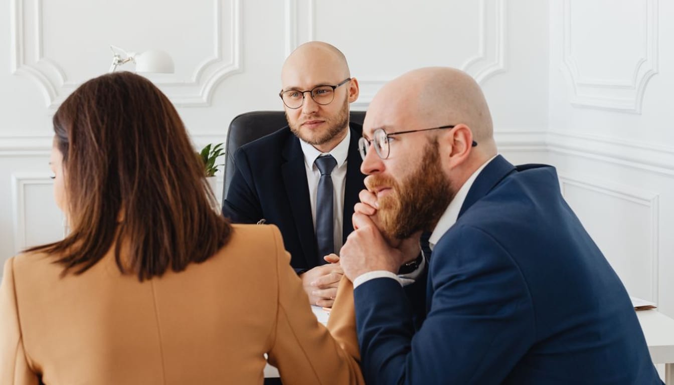 A business owner and a consultant discussing a local SEO plan